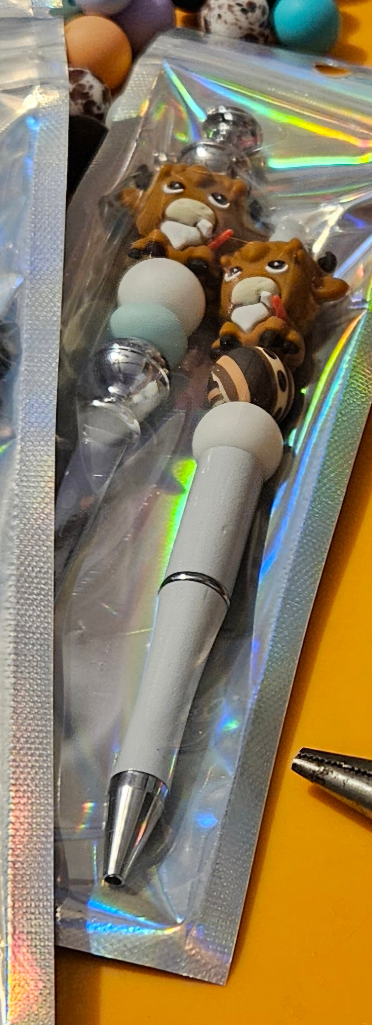 Short extension beaded pen